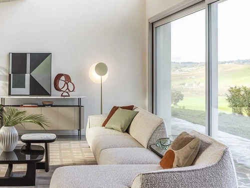 Divano Archibald Sofa System con penisola di Poltrona Frau