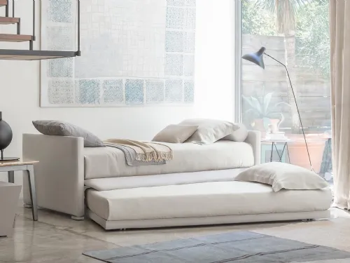 Letto singolo che nasconde sotto la base un secondo letto di servizio, Biss di Flou