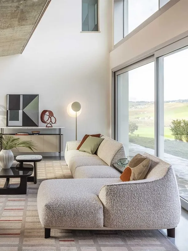 Divano Archibald Sofa System con penisola di Poltrona Frau